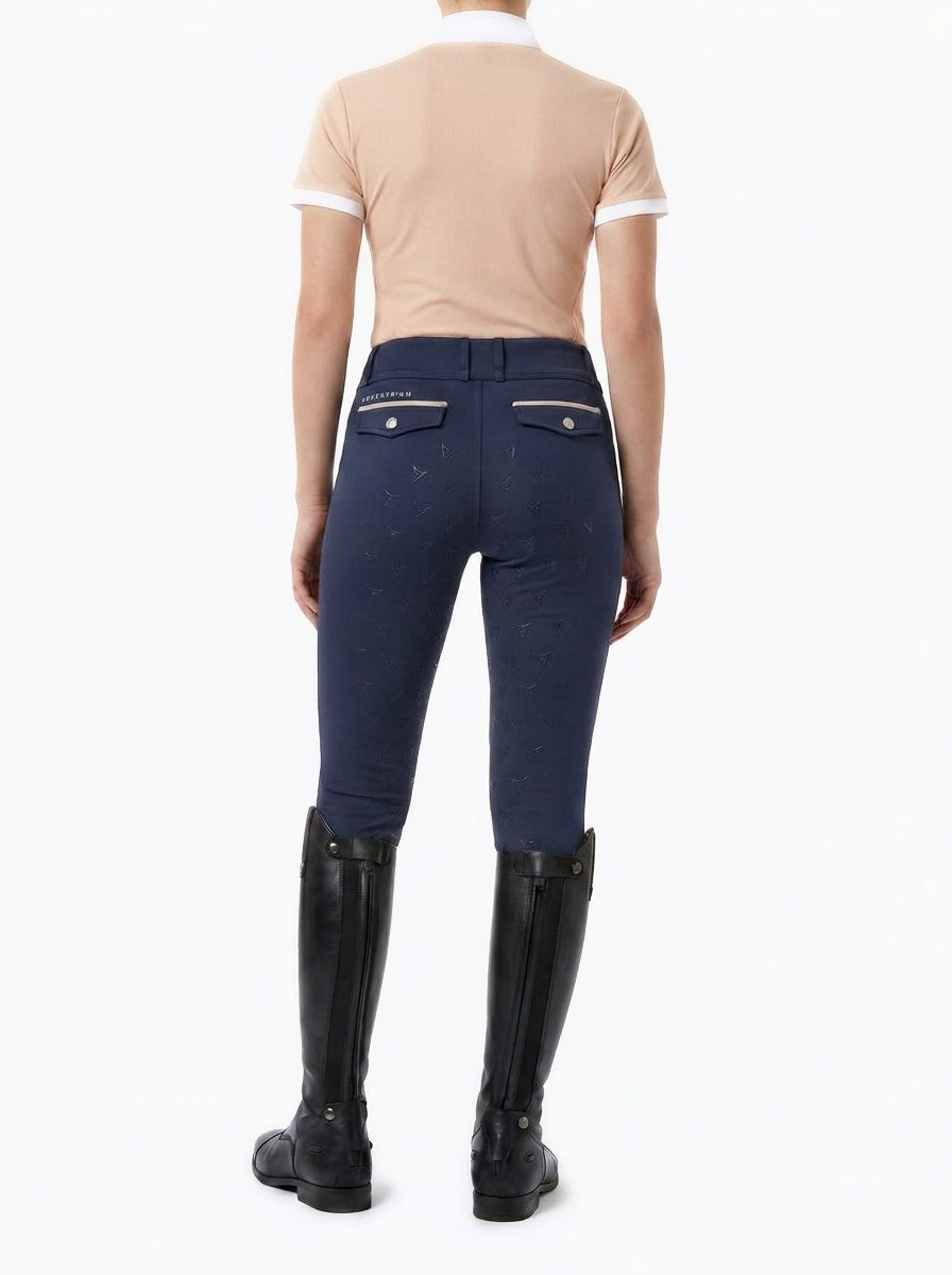 Beige short-sleeve competition show shirt, front view on model — Valerie Equestrian Warmth