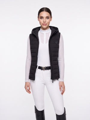Black hooded quilted riding gilet, full-length on model — Valerie Equestrian Assurance
