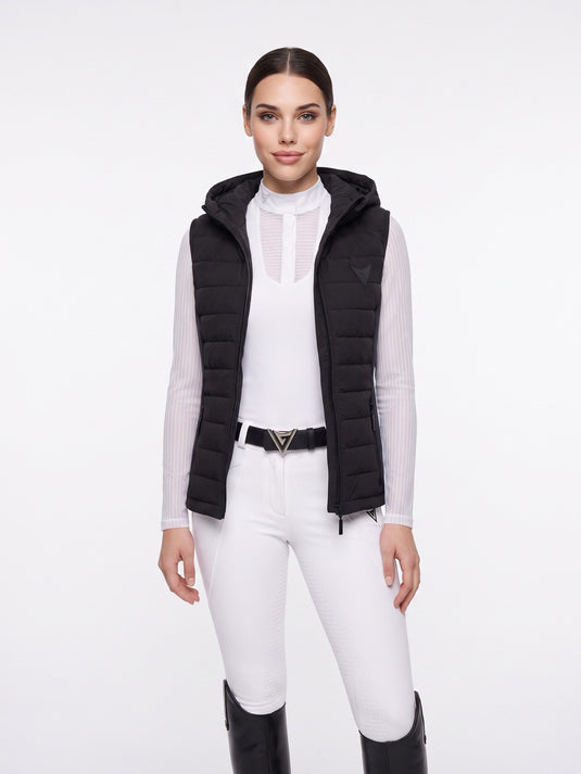 Black hooded quilted riding gilet, full-length on model — Valerie Equestrian Assurance