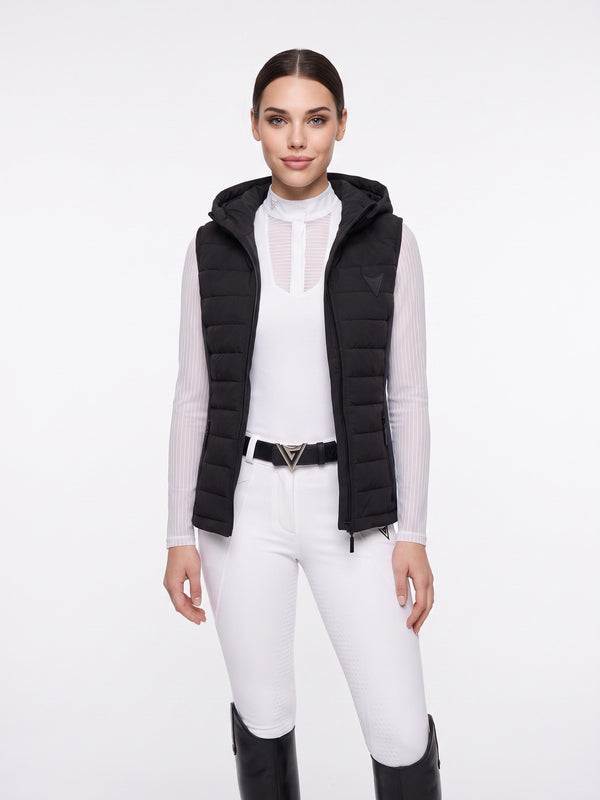 Black hooded quilted riding gilet, full-length on model — Valerie Equestrian Assurance