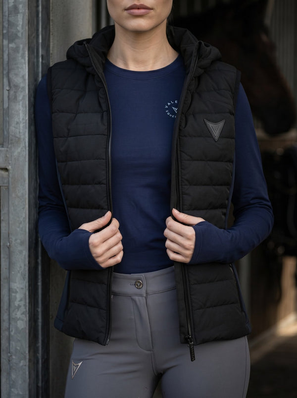 Black hooded riding gilet on model — Valerie Equestrian