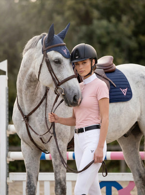 Navy ear bonnet on grey horse, lifestyle — Valerie Equestrian