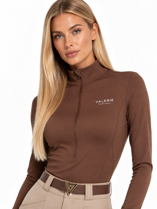 Chocolate perforated zip-up riding turtleneck with VALERIE EQUESTRIAN wordmark, three-quarter view — Valerie Equestrian Resonance