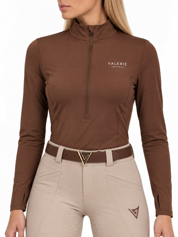 Chocolate zip-up turtleneck, front view with half-length zip and stand-up collar, worn with beige breeches — Valerie Equestrian Resonance