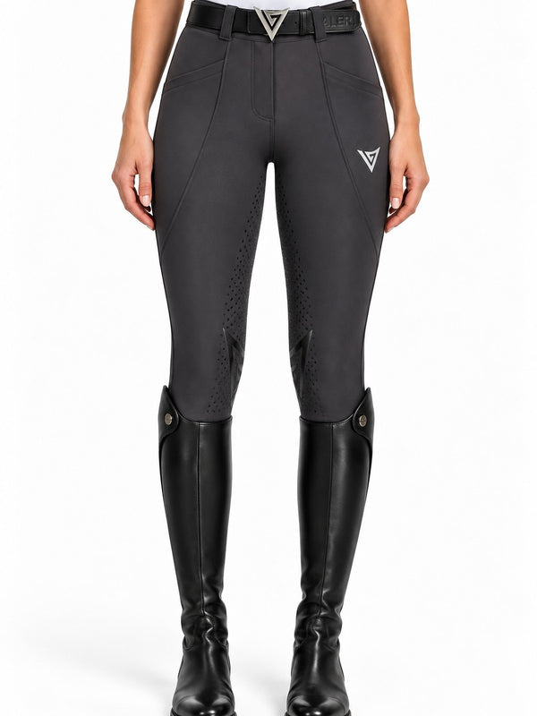 Graphite grey riding breeches, front view with a leather belt showing the shaped seams and knee grip — Valerie Equestrian Momentum