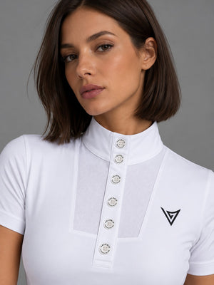 White short-sleeve competition show shirt on a rider, three-quarter view with Valerie Equestrian logotype on the chest — Valerie Equestrian Purity